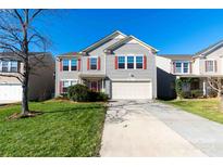 Two-story house with gray siding, red shutters, and a two-car garage at 2138 Durand Rd, Fort Mill, SC 29715