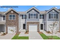 Three-unit townhome building with stone and siding accents at 521 Trading Post Ln, York, SC 29745