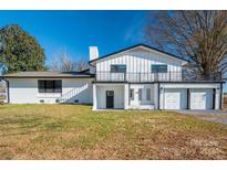 Stunning two-story home with white exterior, black accents, and a two-car garage at 5776 Reepsville Rd, Vale, NC 28168