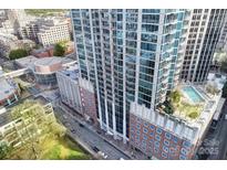 Aerial view of a high rise building with rooftop pool at 210 N Church St # 1213, Charlotte, NC 28202