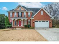 Brick house with a two-car garage and a red front door at 3204 Bannock Dr, Fort Mill, SC 29715