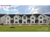 Modern white townhouses with black accents and a picket fence at 324 Ginsberg Rd, Rock Hill, SC 29732