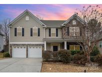 Two-story house with stone accents and a two-car garage at 4836 Pepper Dr, Harrisburg, NC 28075