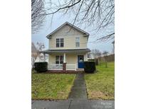 Two-story house with a blue door and a walkway at 7613 Rolling Meadows Ln, Huntersville, NC 28078