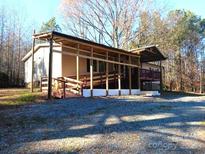 Ranch home with covered porch and ramp access at 176 High Meadow Ln, Mount Gilead, NC 27306