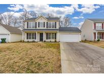 Two-story house with a white garage door and landscaping at 1656 Baylor Dr, Rock Hill, SC 29732