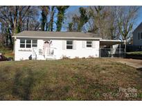 Charming ranch home with white brick exterior and carport at 208 Nila Dawn Ave, Gastonia, NC 28052