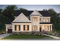 Two-story house with gray siding, dark shutters, and landscaping at 14113 White Gardens Ln # 7, Huntersville, NC 28078