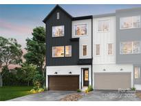 Modern two-story townhome with dark and light siding, and a two-car garage at 8004 Cedarsmith Ct, Charlotte, NC 28217