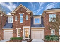 Brick front of charming townhome with two-car garage at 837 Park Slope Dr, Charlotte, NC 28209