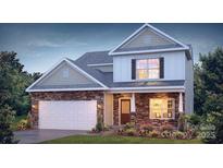 Two-story house with stone accents and a two-car garage at 1373 6Th Ne St, Hickory, NC 28601