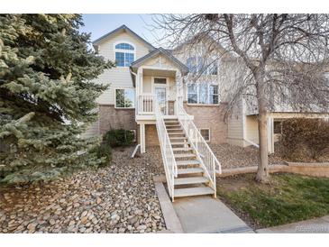 Two-story townhome with a staircase and landscaping at 18242 E Bethany Pl, Aurora, CO 80013