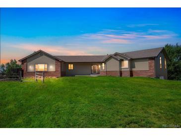 Stunning ranch-style home with brick and siding exterior at 2203 S County Road 185, Byers, CO 80103