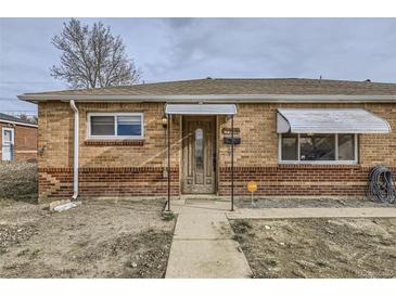 Brick ranch home with a carport and mature trees at 9030 Hickory Pl, Thornton, CO 80229
