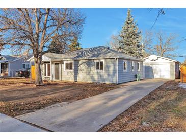 Newly renovated home with a spacious front yard and attached garage at 862 N Uvalda St, Aurora, CO 80011