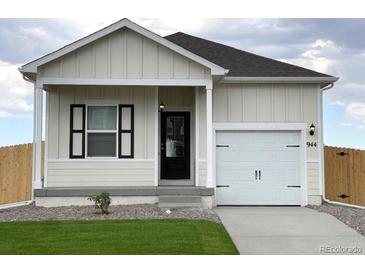 Charming house with white siding and black accents at 944 Savona Ave, Fort Lupton, CO 80621