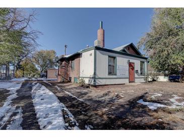 Front view of a commercial building with signage and snowy driveway at 3333 Colorado Blvd, Denver, CO 80205