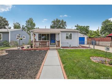 Charming bungalow with landscaped yard and walkway at 7940 Pontiac St, Commerce City, CO 80022