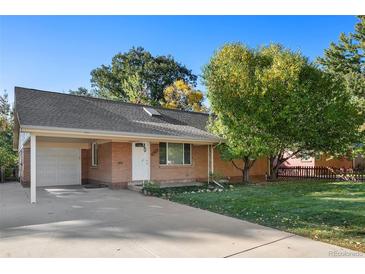 Ranch-style house with attached garage at 1575 S Clermont St, Denver, CO 80222
