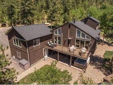 Aerial view of two-story home with deck and hot tub at 12171 S Critchell Ln, Littleton, CO 80127