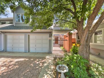 Exterior view of a townhome with a courtyard and double garage at 7264 Siena Way # C, Boulder, CO 80301