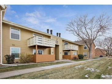 Tan building exterior with several individual balconies at 10251 W 44Th Ave # 6-202, Wheat Ridge, CO 80033