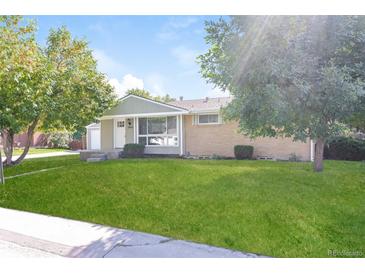 Ranch style home with well-manicured lawn and driveway at 2866 E Euclid Pl, Centennial, CO 80121