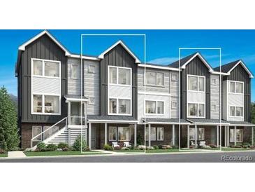 Three-story townhomes with modern exterior design at 688 Saddle Dr, Erie, CO 80516