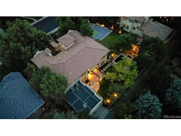 Aerial view of house showcasing backyard and landscaping at 235 Eudora St, Denver, CO 80220