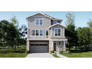 Two-story home with gray siding, stone accents, and a two-car garage at 6726 E 149Th Dr, Thornton, CO 80602