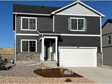 Two-story house with gray siding, white trim, and a two-car garage at 3305 Belleville Ridge Rd, Elizabeth, CO 80107