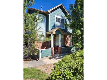 Exterior view of a two-story home with a brick and teal facade at 2855 Rock Creek Cir # 158, Superior, CO 80027