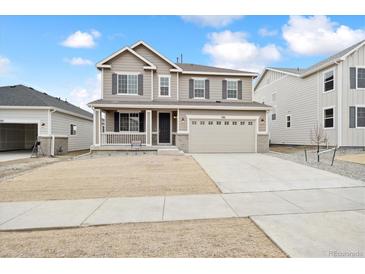 Two-story house with attached garage and landscaping at 1381 Zenith Heights Ct, Erie, CO 80516