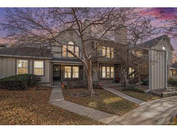 Exterior view of a charming two-story townhome with autumn leaves at 9612 W Chatfield Ave # C, Littleton, CO 80128