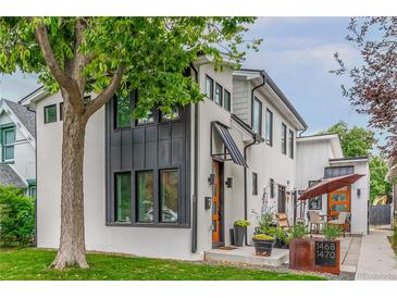 Modern two-story home with gray and white exterior, and a patio at 1468 S Washington St, Denver, CO 80210