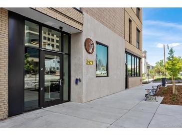 Building exterior showcasing modern design and landscaping at 3575 Chestnut Pl # 605, Denver, CO 80216