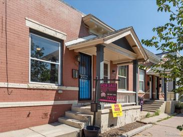 Brick house for sale with a front porch and yard at 160 S Cherokee St, Denver, CO 80223