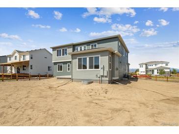 Exterior view of a two-story home with a fenced backyard at 1798 Marlowe W Cir, Erie, CO 80516