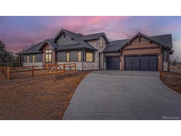 Two-story craftsman style home with 3-car garage at 14560 N Navajo Ct, Broomfield, CO 80023