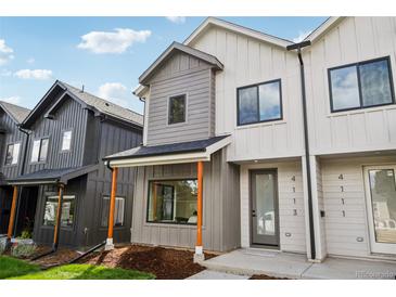 Modern two-story home with gray and white siding, and a covered porch at 4103 S Lincoln St, Englewood, CO 80113