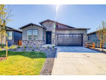 Modern two-story home with gray siding and stone accents at 23902 E 40Th Ave, Aurora, CO 80019