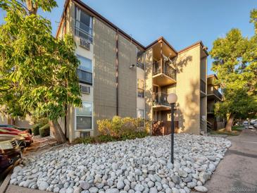 Two-story condo building exterior with landscaping at 2281 S Vaughn Way # 111A, Aurora, CO 80014