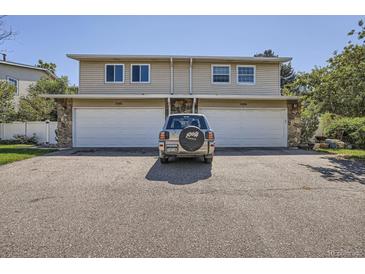 Two-unit building with attached garages and landscaping at 2466 S Vaughn Way # B, Aurora, CO 80014