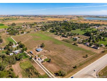 Aerial view of a ranch house on a large lot with outbuildings at 1637 S Us Highway 287, Berthoud, CO 80513