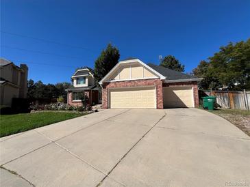 Two-story home with a three-car garage at 5603 S Pagosa Ct, Centennial, CO 80015