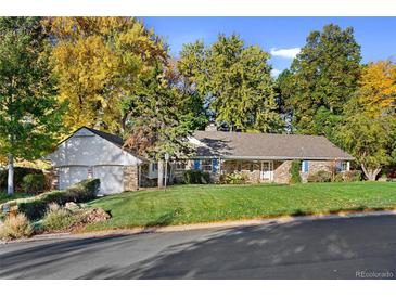 Charming ranch home with landscaped yard and attached garage at 4041 S Dexter St, Cherry Hills Village, CO 80113