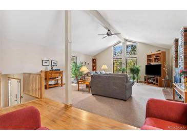 Spacious living room with vaulted ceilings and fireplace at 2732 S Oakland E Cir, Aurora, CO 80014