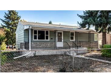 Charming ranch home with a well-maintained front yard at 924 Quitman St, Denver, CO 80204