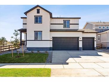 Two-story house with a two-car garage and landscaped yard at 5768 Ranch St, Mead, CO 80504