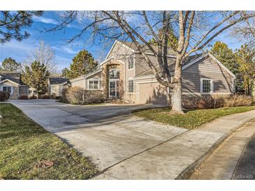 Two-story house with stone accents and a two-car garage at 7400 W Grant Ranch Blvd # 43, Littleton, CO 80123